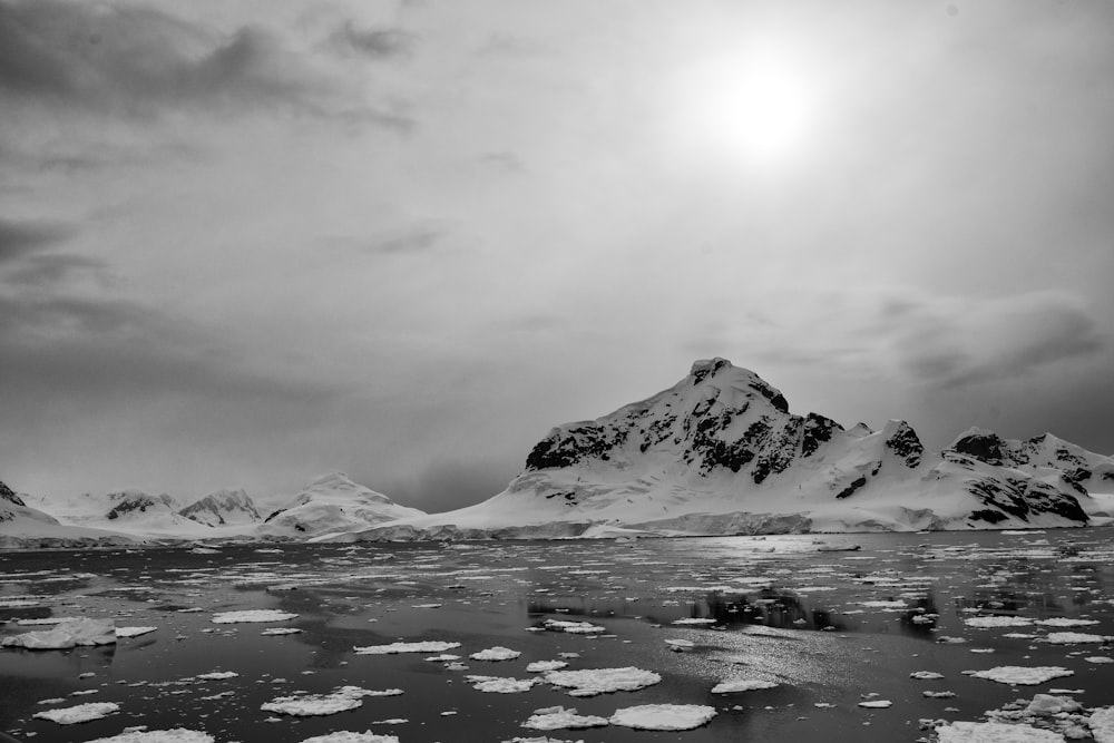 grayscale photo of mountain covered with snow