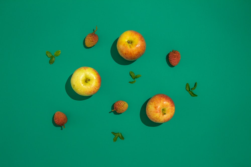 four red and green apple fruits