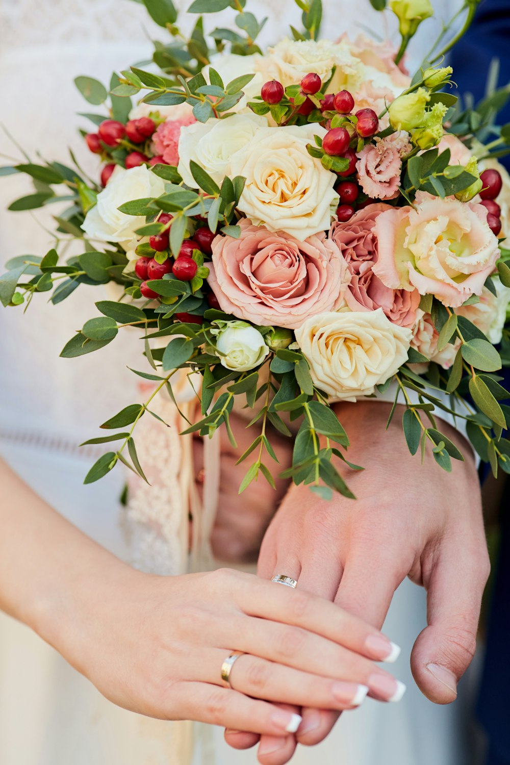 woman holding pink rose bouquet