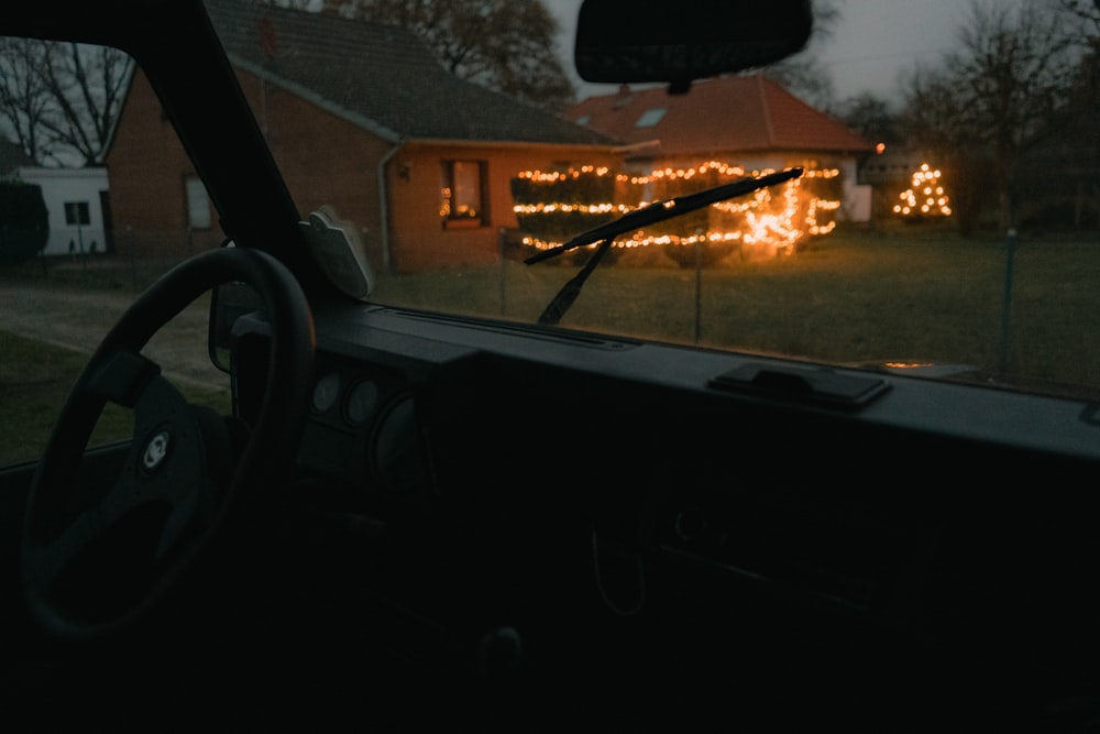 car parked near house during night time