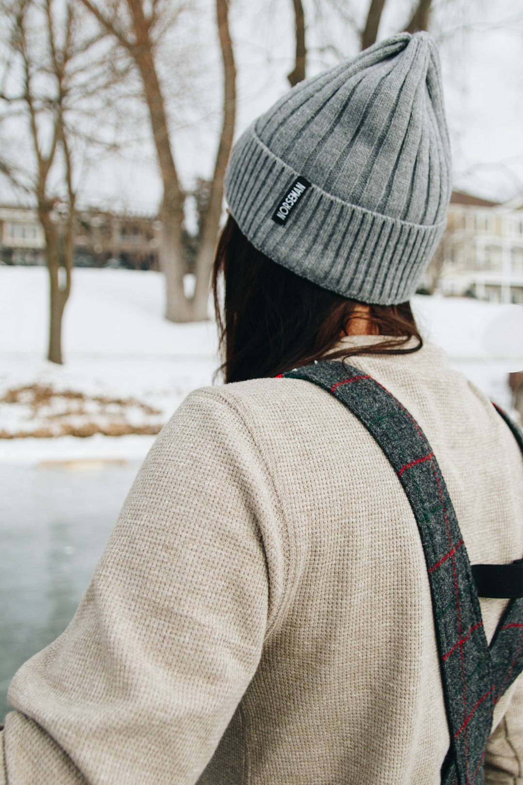 woman in gray knit cap and gray coat