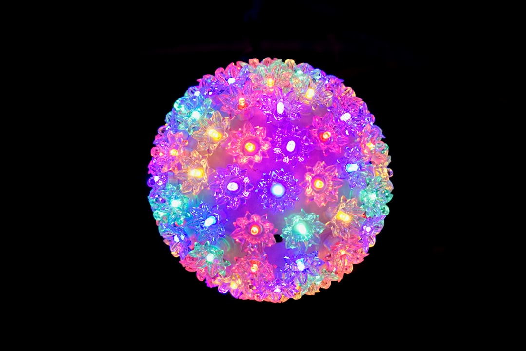 pink green and blue round ornament