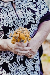 person holding brown and green plant