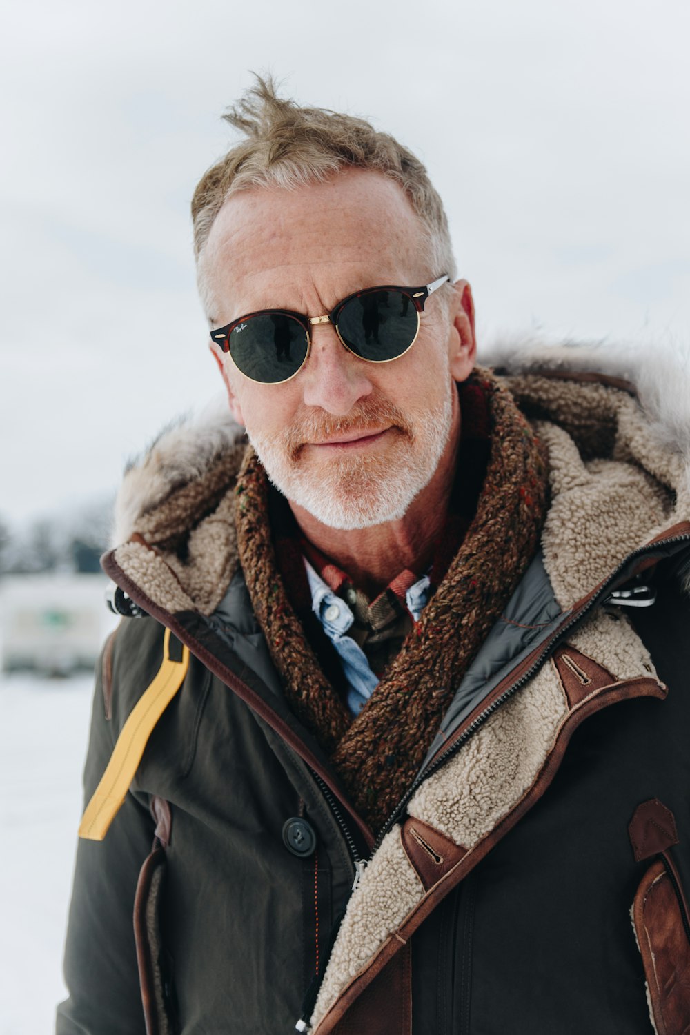 man in black jacket wearing sunglasses