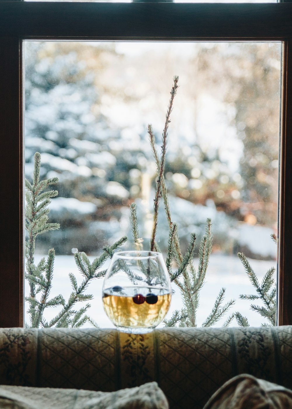 clear glass cup on brown wooden table