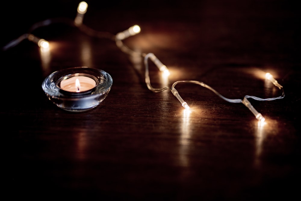 silver ring on brown wooden table