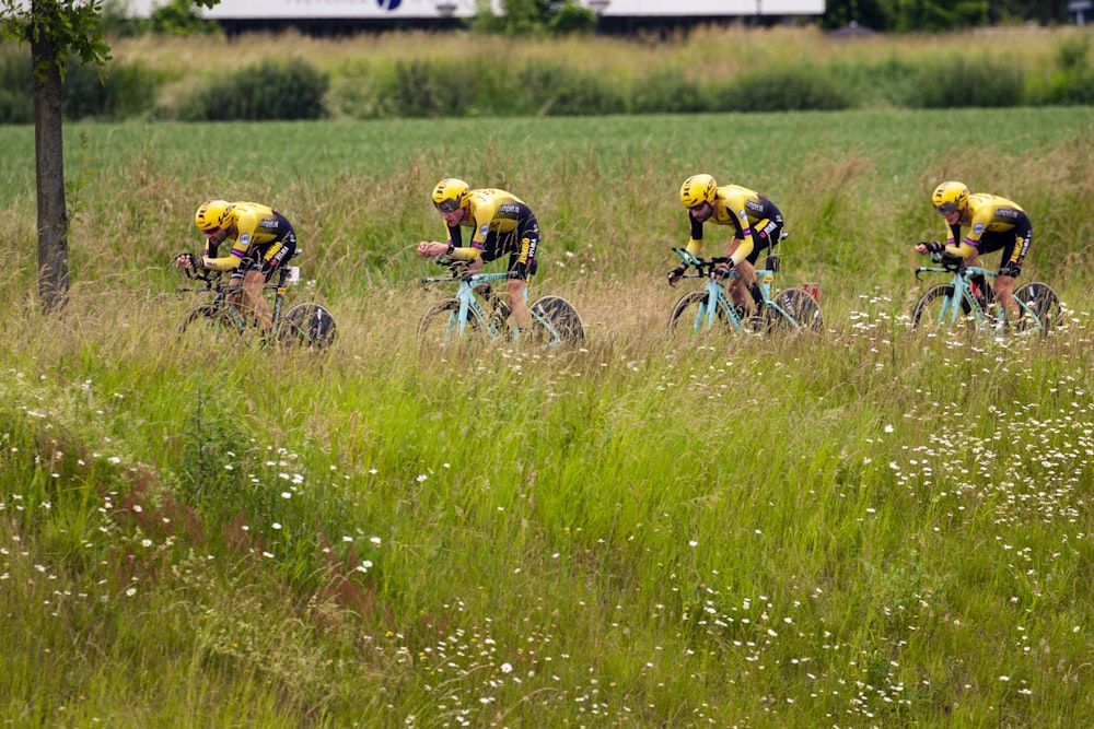 bicycle racing on green grass field during daytime