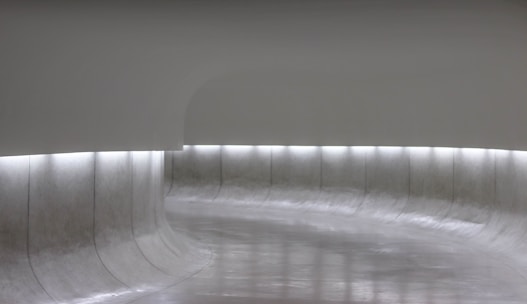 A serene futuristic landscape blending soft light and minimalist design elements.