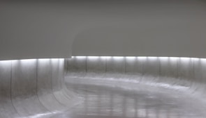 Cozy and elegant model satellite room with minimalist decor and futuristic lighting.