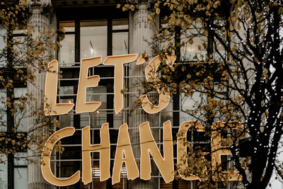 Banner printed in high definition indicating a change of address with bold lettering.