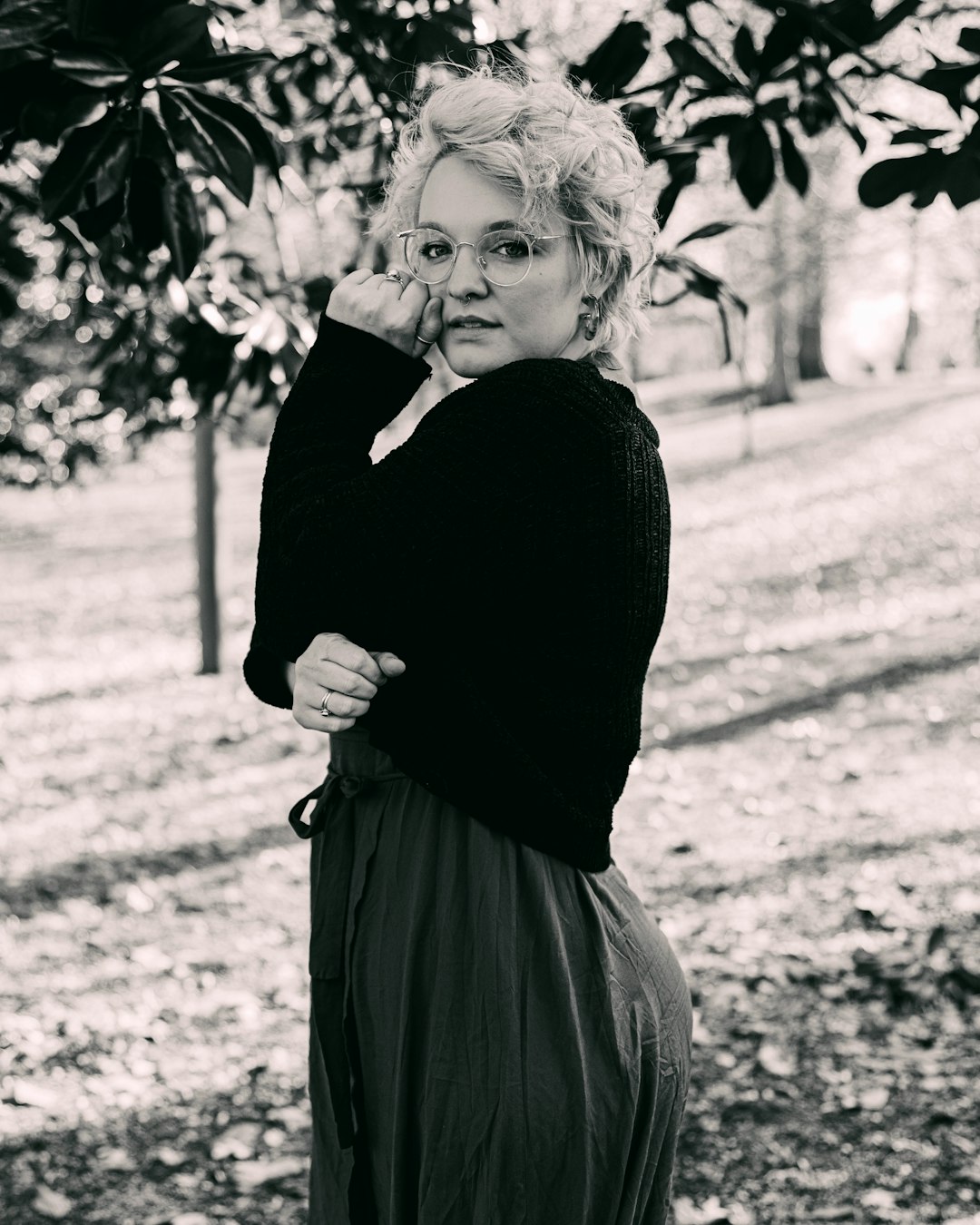 grayscale photo of woman in black long sleeve dress