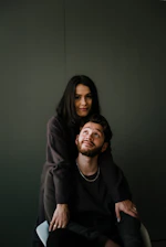man in black crew neck shirt beside woman in black long sleeve shirt