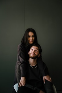 man in black crew neck shirt beside woman in black long sleeve shirt