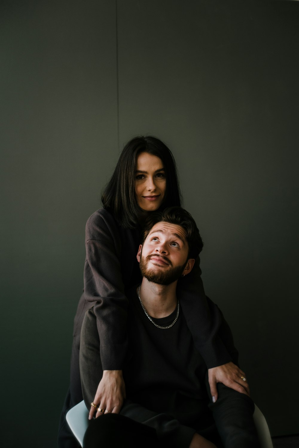 man in black crew neck shirt beside woman in black long sleeve shirt