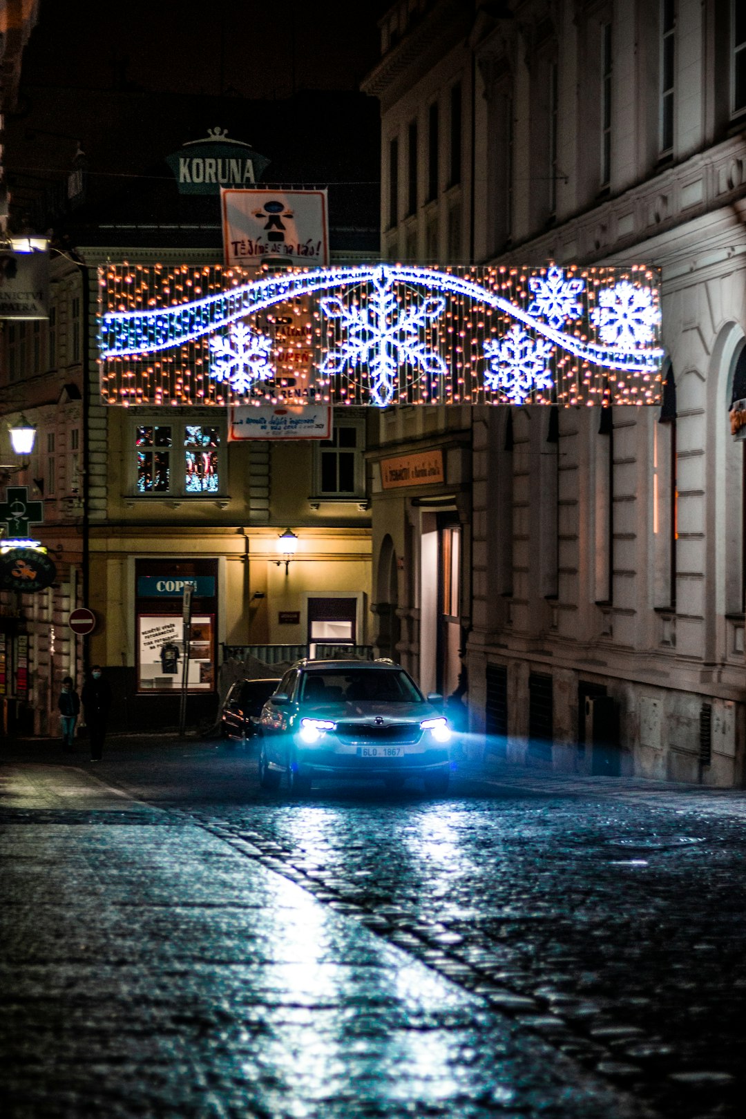 cars parked beside building during night time