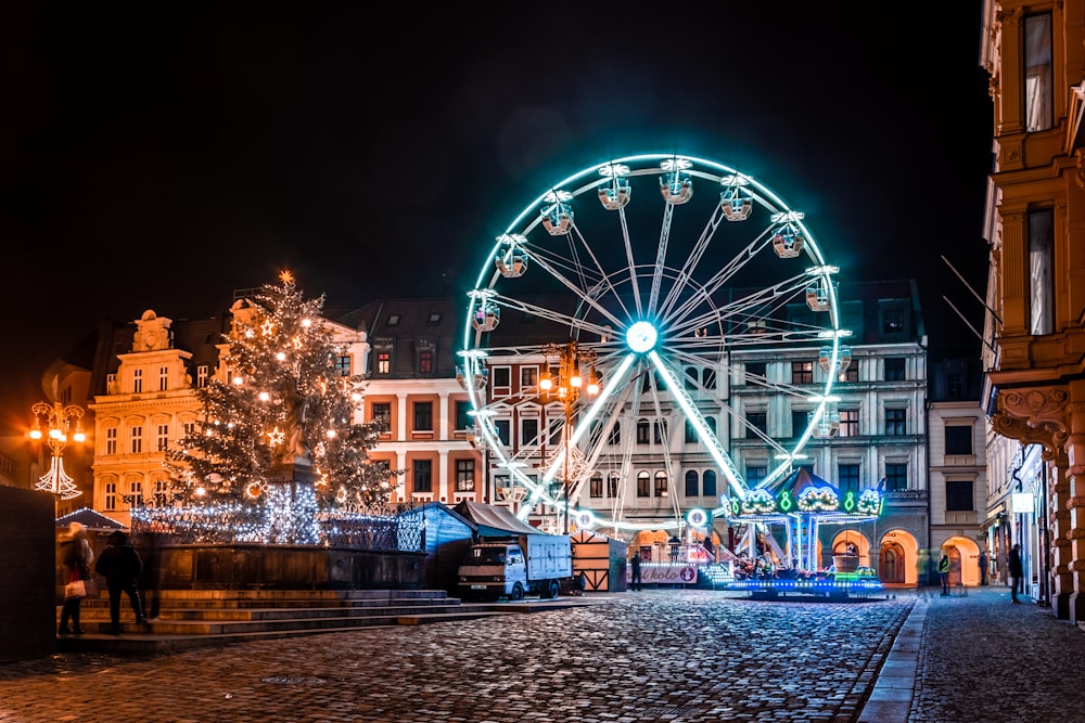 ferris wheel with lights turned on during night time