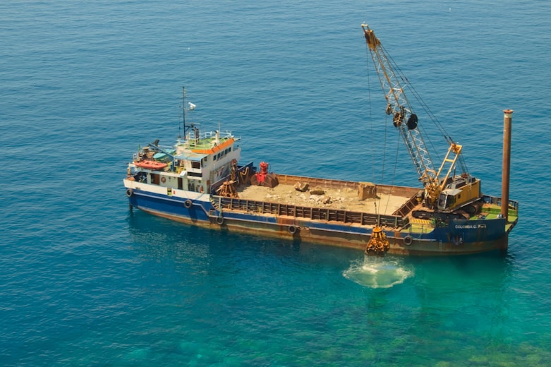 white and brown ship on sea during daytime