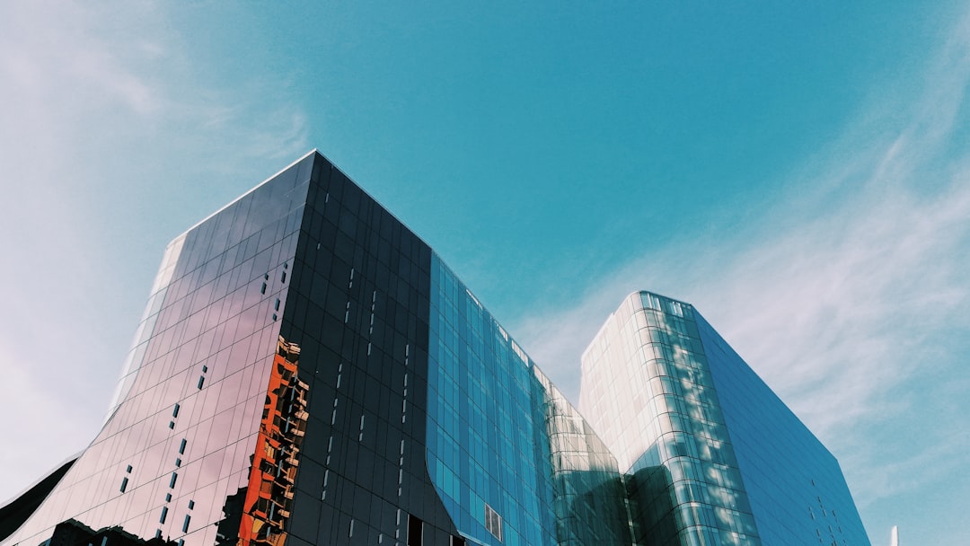 blue glass walled high rise building