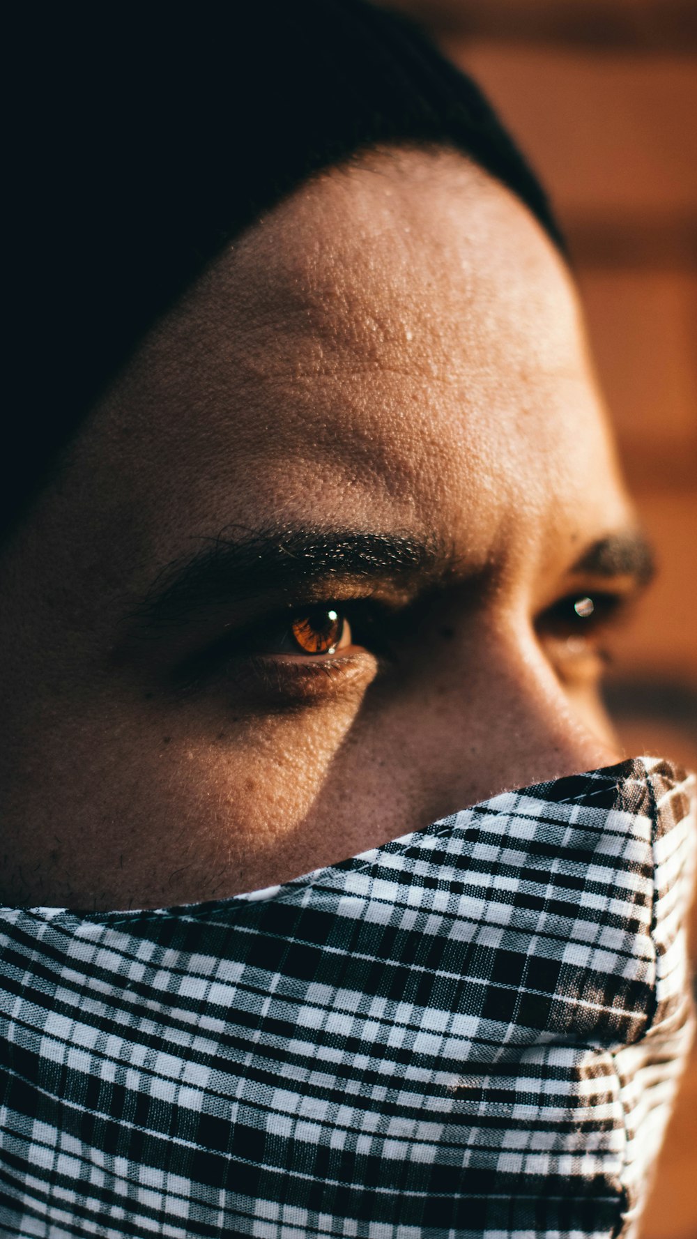 man in white and blue plaid shirt