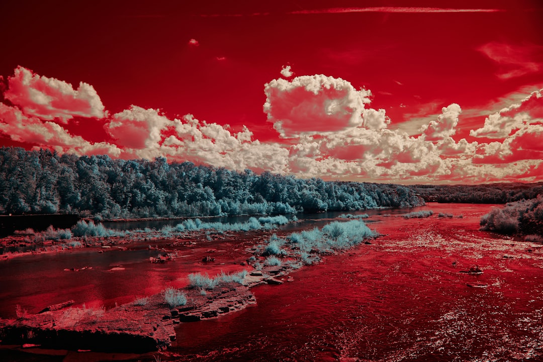 body of water under cloudy sky during daytime