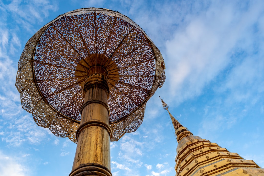 a large umbrella sitting on top of a metal pole,