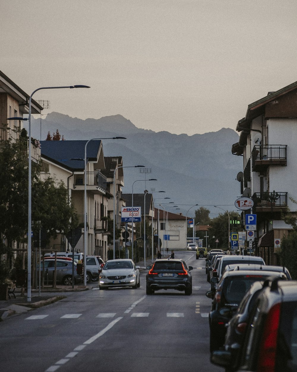 cars parked on side of the road during daytime