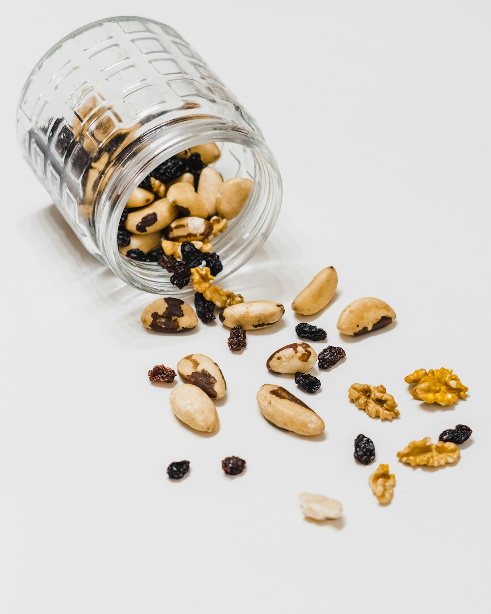 brown coffee beans on clear glass jar