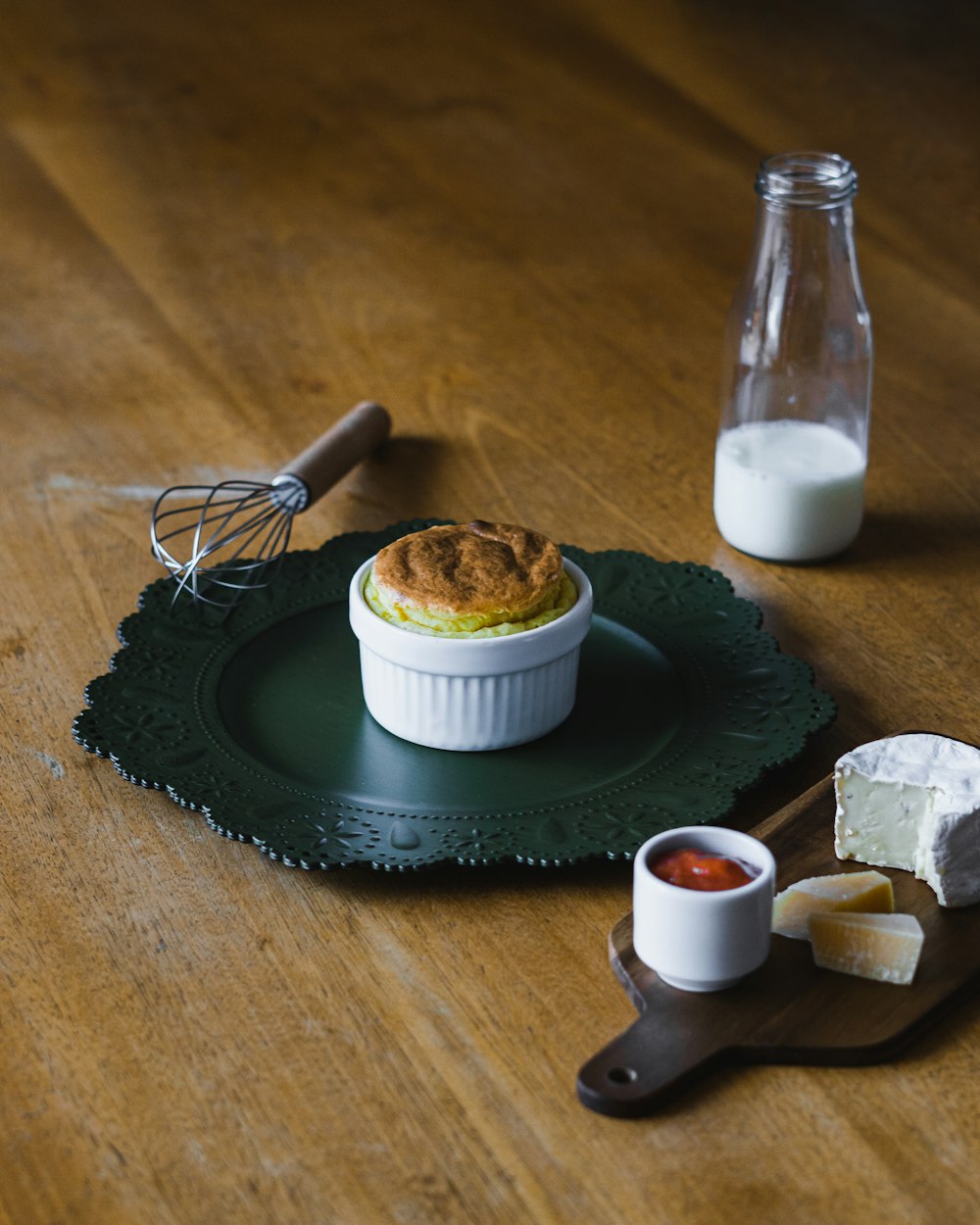 white ceramic round bowl on black round mat