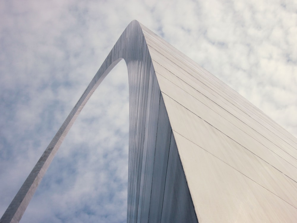 gray concrete building under white clouds during daytime