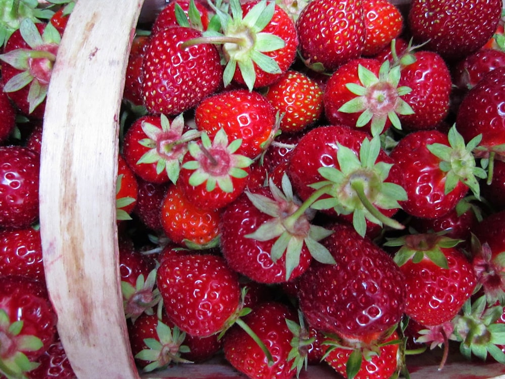 red strawberries in white plastic container