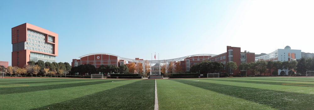 brown building near green grass field during daytime