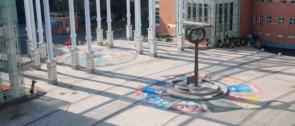 black metal stand on sidewalk during daytime