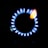 A stove burner with a ring of blue flames surrounding a central black disc, with a hint of orange flame visible at one spot.