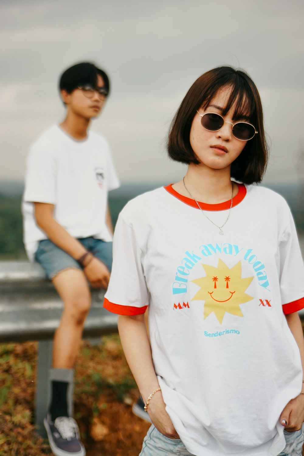 woman in white crew neck t-shirt wearing black sunglasses