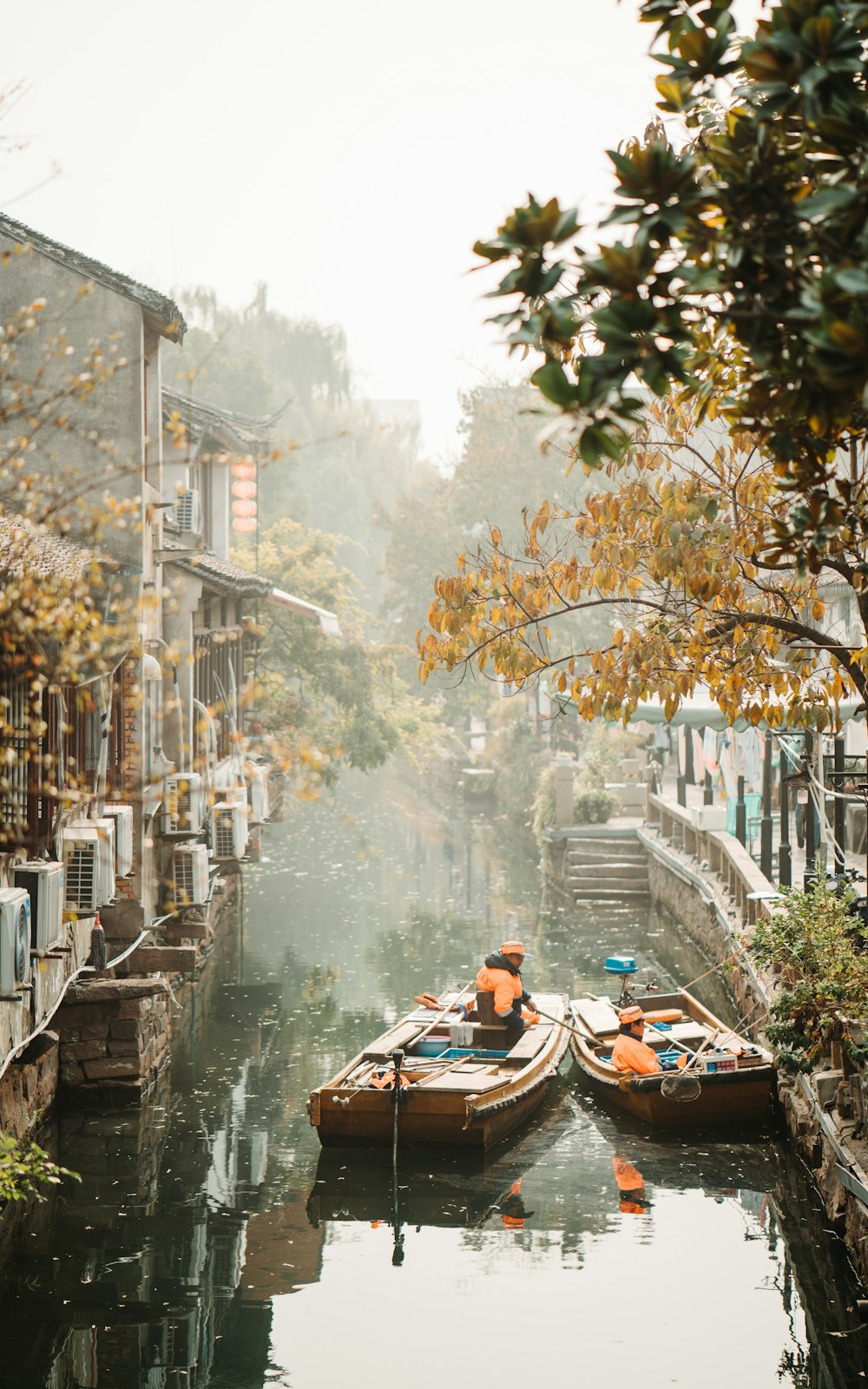 man riding on boat on river during daytime