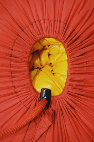 Close-up of a vėjas laundry bag made from soft, breathable fabric with a sturdy drawstring.