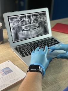 macbook air on brown wooden table