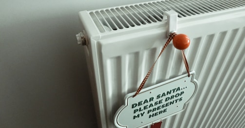 a radiator with a sign attached to it
