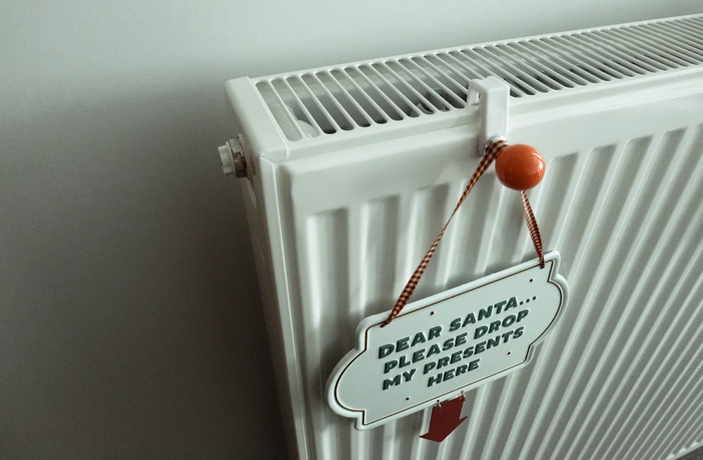 a radiator with a sign attached to it