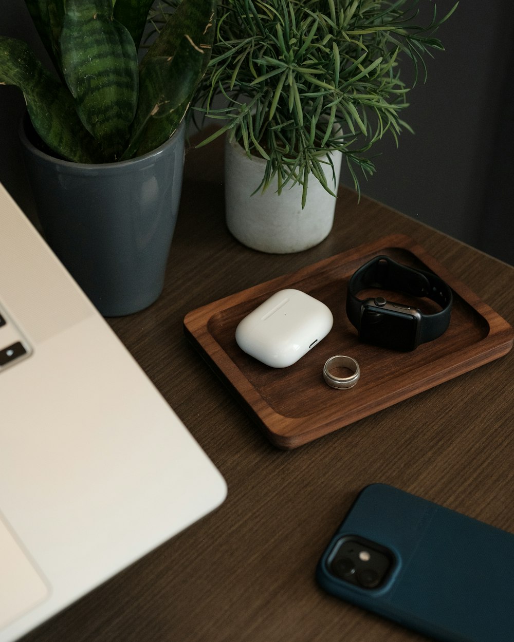 apple magic mouse beside apple magic mouse on brown wooden table