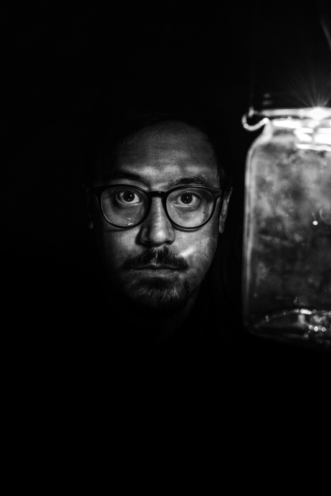 man in black framed eyeglasses wearing black framed eyeglasses