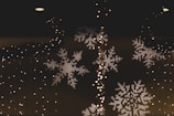 Winter wonderland backdrop featuring snowflakes and twinkling lights.