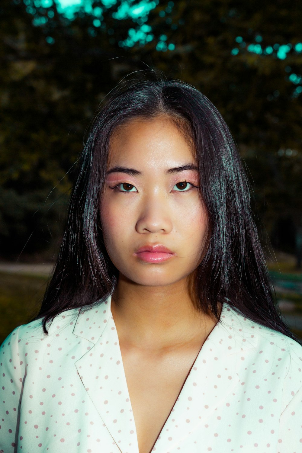 girl in white and black polka dot shirt