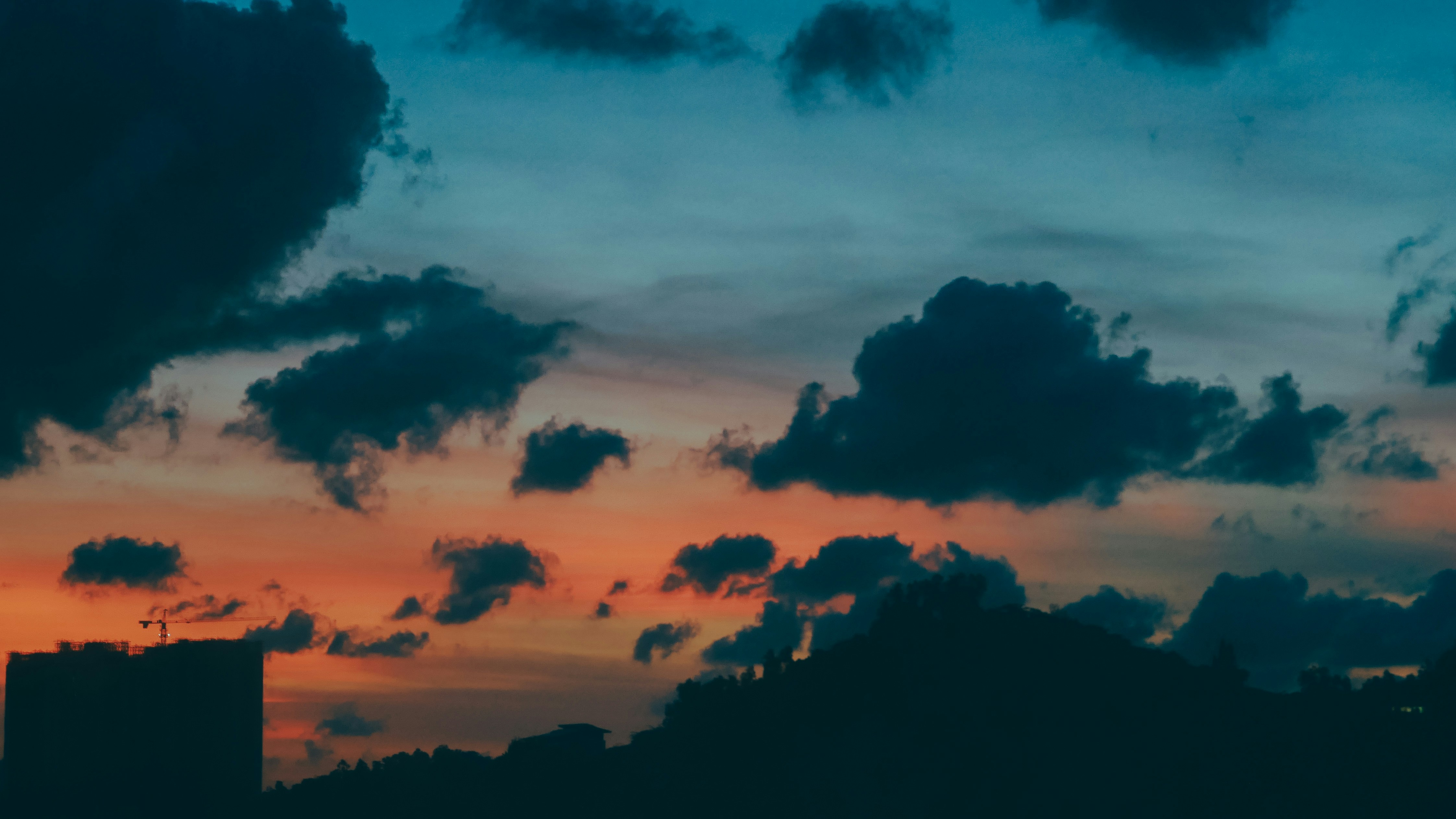 Silhouette of trees under mystical sunset sky