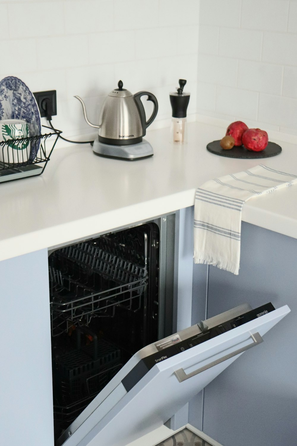 stainless steel kettle on white kitchen counter