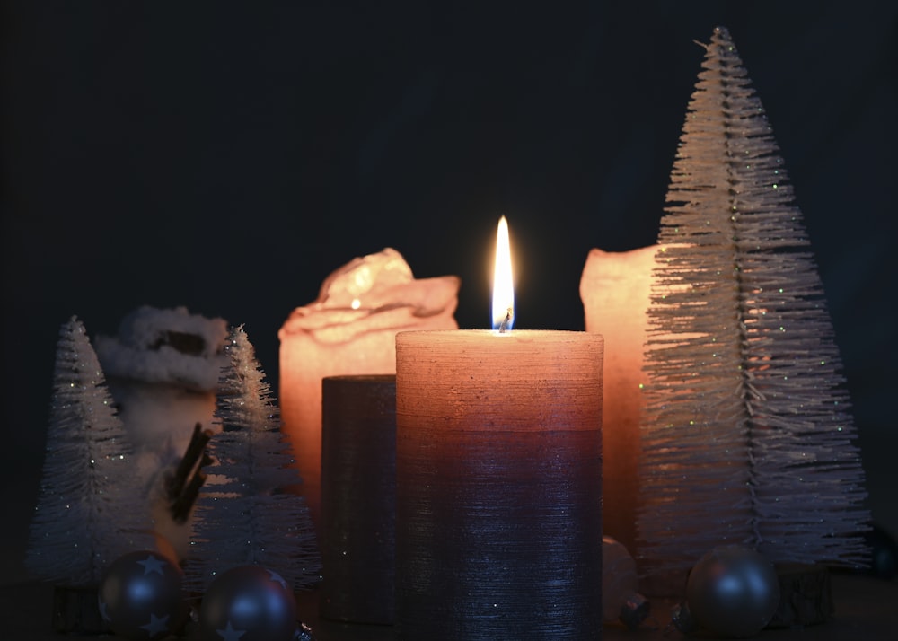 lighted candles on black surface