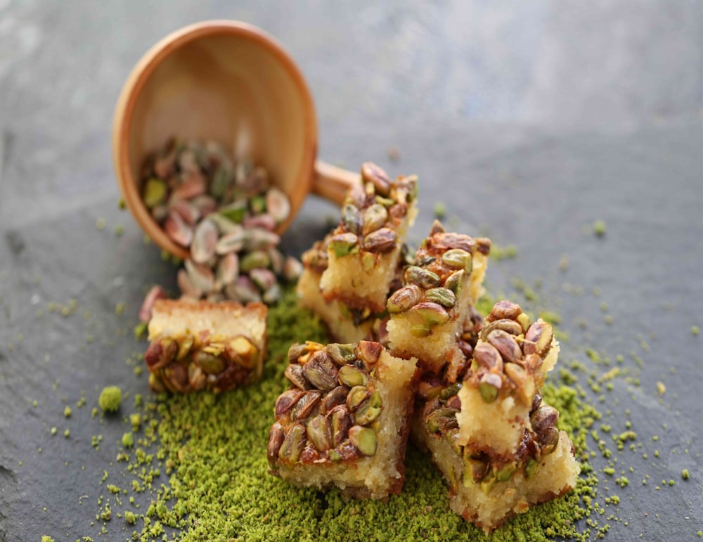 brown and green food on brown wooden bowl