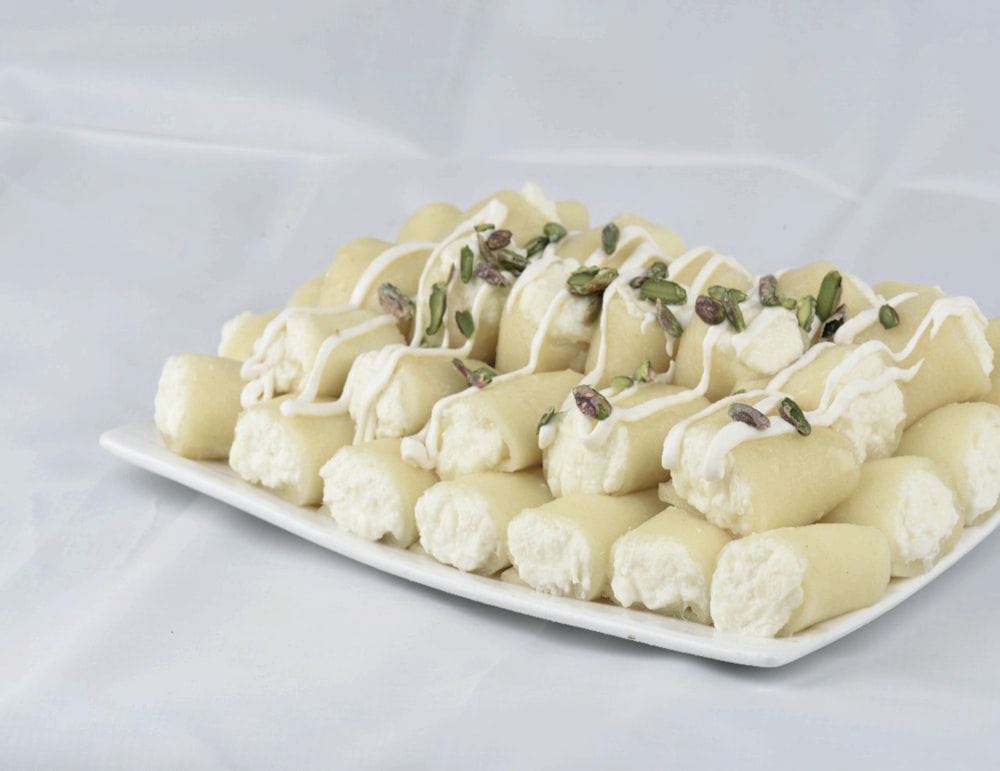 white and yellow food on white ceramic plate