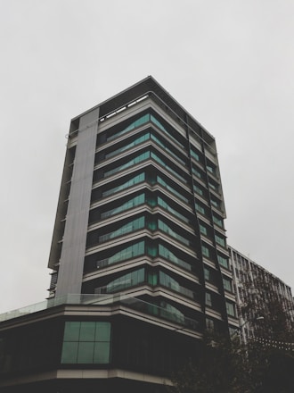 gray concrete building under white sky during daytime