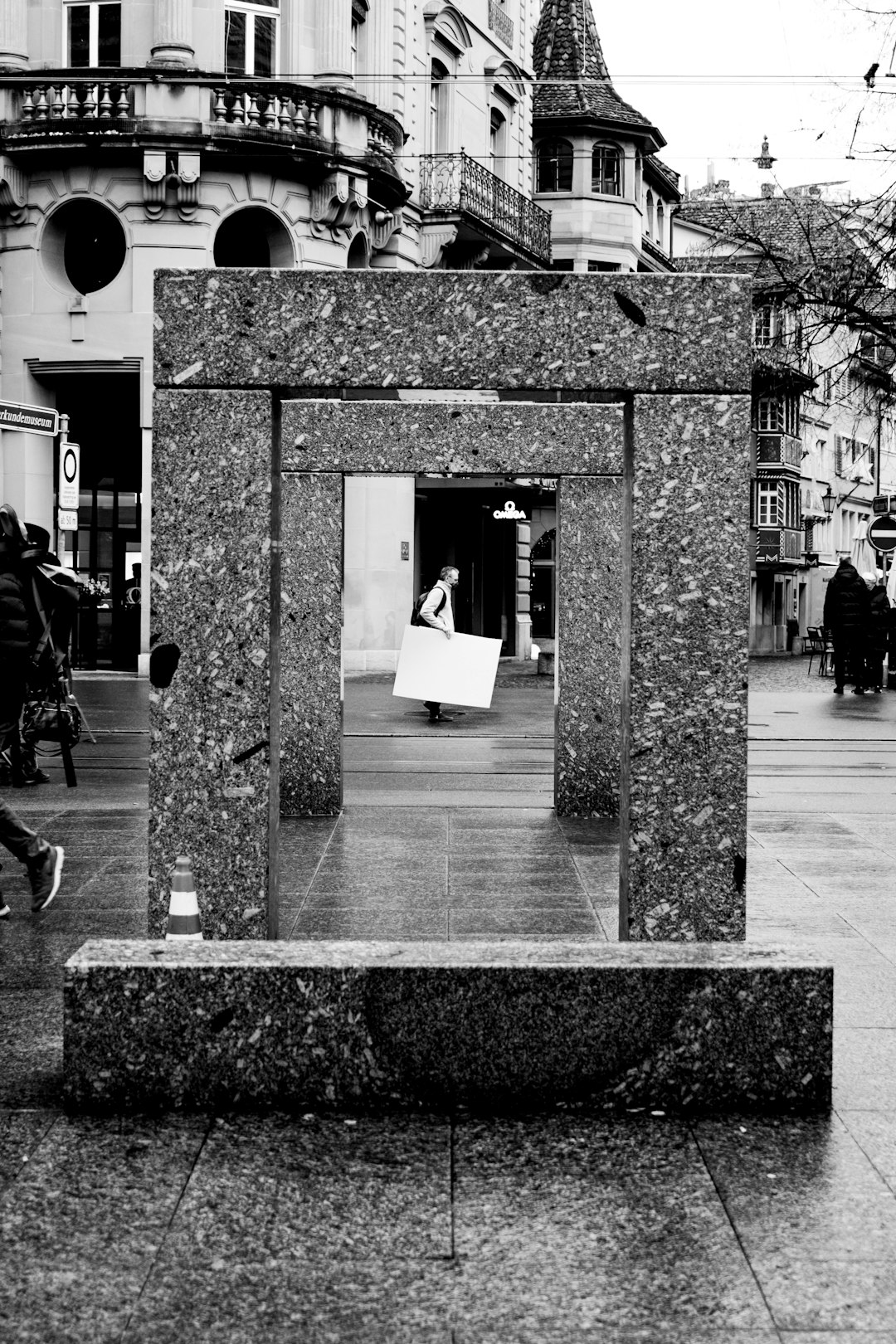 grayscale photo of people walking on sidewalk